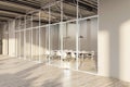 Modern office meeting room with glass partitions, furnished with white chairs and a conference table, beige and wood design, empty Royalty Free Stock Photo