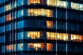 Modern Office with Night time Illumination and Shadows, business people working inside. AI generative Royalty Free Stock Photo