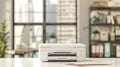 Modern office printer on a light table with minimalist decor and large sunny windows in a professional workspace. concept of Royalty Free Stock Photo