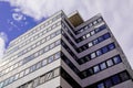 Modern office and residential building facade against a nice blue white cloudy sky Royalty Free Stock Photo