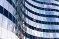 Modern office skyscraper with glass windows and sky reflection Royalty Free Stock Photo