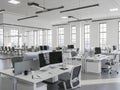 Modern office space with desks computers and natural light showing a collaborative environment Royalty Free Stock Photo