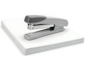 Modern office stapler on a stack of paper Royalty Free Stock Photo
