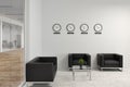 Office wating room with armchairs and clocks Royalty Free Stock Photo