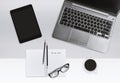 Modern office workplace concept. Laptop and notebook with task list and coffee cup. Royalty Free Stock Photo