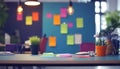 modern creative workspace with colorful sticky notes on blue wall and potted plants on desk in office environment Royalty Free Stock Photo