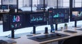 A modern office workspace with multiple computer monitors and data analysis screens Royalty Free Stock Photo