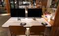 Modern office workspace station with apple iMac computers on a wooden white table - Creative space and work