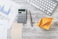 Modern office workspace with yellow paper ship