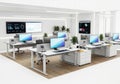 Modern office workstation setup featuring multiple computer desks and technology displays Royalty Free Stock Photo