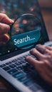 Modern Online Search Concept with a User Typing in a Search Bar on a Laptop Screen Symbolizing Information Access