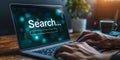 Modern Online Search Concept with a User Typing in a Search Bar on a Laptop Screen Symbolizing Information Access
