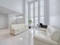 Modern open living room area with marble floors Royalty Free Stock Photo