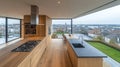 Modern open-plan kitchen with panoramic city view, overlooking landscaped garden Royalty Free Stock Photo