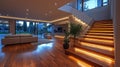 Modern open-plan living area with wooden stairs and illuminated features Royalty Free Stock Photo