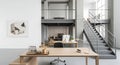 Modern open-plan office interior with desks, computers, and industrial staircase Royalty Free Stock Photo