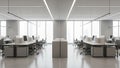 Modern Open Plan Office Interior with Rows of Desks Computers and Natural Light Streaming Through Large Windows Royalty Free Stock Photo