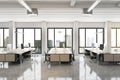 Modern open space office with city skyscrapers view from big window, wooden furniture and glossy concrete floor Royalty Free Stock Photo