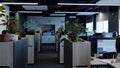 Modern open space office interior with many green plants, furniture, big windows. HDR. Office managers working at Royalty Free Stock Photo