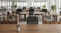Modern openplan office workspace with desks and office chairs in a bright environment Royalty Free Stock Photo