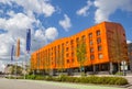 Modern orange apartment building on the Euroborg square in Groningen