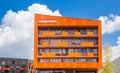 Modern orange apartment building Hete Kolen in Groningen