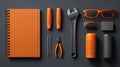 Modern Orange and Black Workshop Essentials Flat-Lay with Tools, Notebook and Accessories for Branding, DIY and Marketing Use Royalty Free Stock Photo
