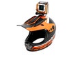 Modern orange helmet motorcyclist with action camera looking per