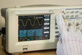 Modern oscilloscope, man`s hand adjusting wave signals, closeup