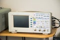 Modern oscilloscope in repair service, technical equipment, blank screen, no graph