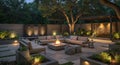 Modern Outdoor Patio Design at Night with Fire Pit and Water Feature Royalty Free Stock Photo