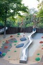 Modern outdoor playground with slides and climbing frames