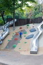 Modern outdoor playground with slides and climbing frames