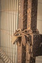 Modern padlock hanging on old rusty metal chain Royalty Free Stock Photo