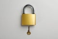 Modern padlock with key on light background, flat lay