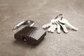 Modern padlock and keys on grey marble table, closeup Royalty Free Stock Photo