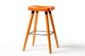 Modern painted orange stool chair with wooden legs bar seat isolated on white background Royalty Free Stock Photo