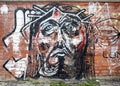 Modern painting graffiti on a wall in Bucharest representing Jesus Christ face Royalty Free Stock Photo