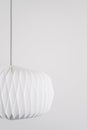 Modern paper pendant lamp on white background Royalty Free Stock Photo