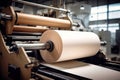 Modern paper production plant. Close-up of industrial equipment. Coated paper and cardboard