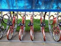 Modern parking with a bicycle roof next to an apartment building with a lot of bikes. Eco-friendly and sports transport Royalty Free Stock Photo