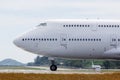 Modern passenger double-decker airplane is taxiing to take off. .Wide-body aircraft on runway, close up, side view Royalty Free Stock Photo