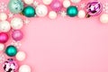 Pastel Christmas bauble corner border over a pink background Royalty Free Stock Photo