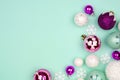 Pastel Christmas bauble corner border over a turquoise background Royalty Free Stock Photo