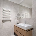 Modern, patterned tiles in small bathroom