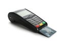 Modern payment terminal with credit card on white background. Royalty Free Stock Photo