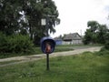 A modern payphone telephone in the middle of a village in the remote Russian hinterland Royalty Free Stock Photo