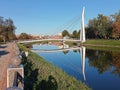 Modern pedestrian bridge with river reflection Royalty Free Stock Photo