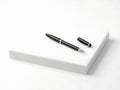 Modern pen and cap on notepad Royalty Free Stock Photo