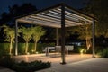 modern pergola with sleek metal frame, lit by uplighting Royalty Free Stock Photo